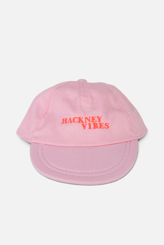 Light Pink Baby Cap with fluorescent coral orange text 'Hackney Vibes' embroidered