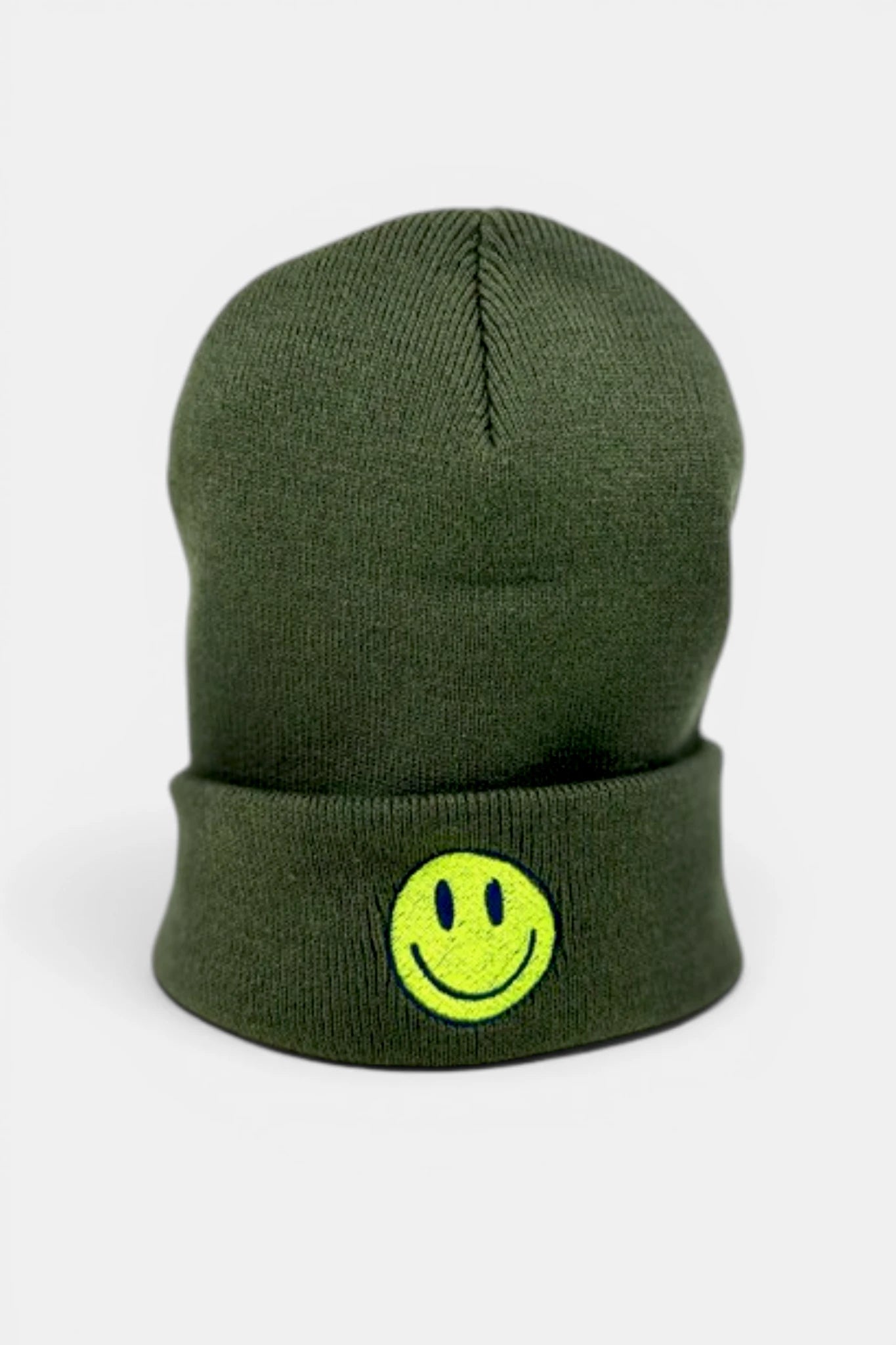 An olive green beanie with a folded cuff featuring a bright yellow-green embroidered smiley face, shown against a plain light gray background.