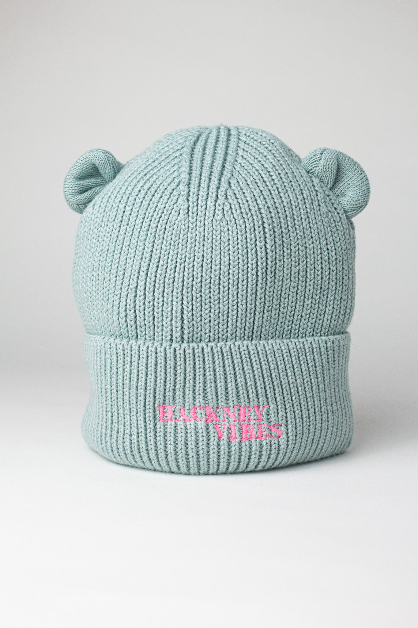 Sage green baby bear beanie with bear ears and fluorescent coral Hackney Vibes embroidery